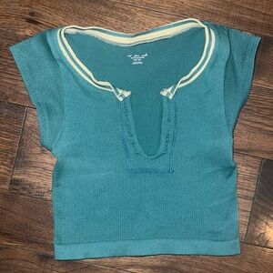 Out from under turquoise shirt (size xs/s)